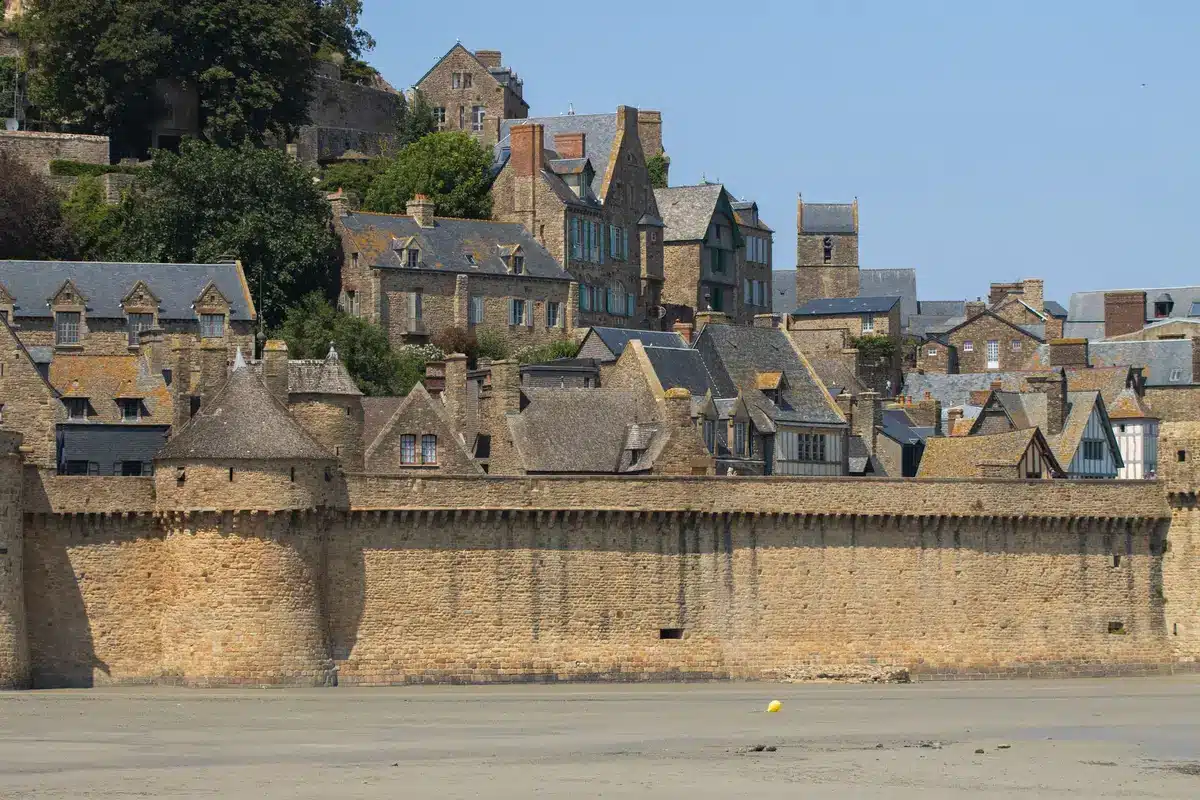 Narrow medieval streets with stone buildings and harbour views in a quiet coastal village