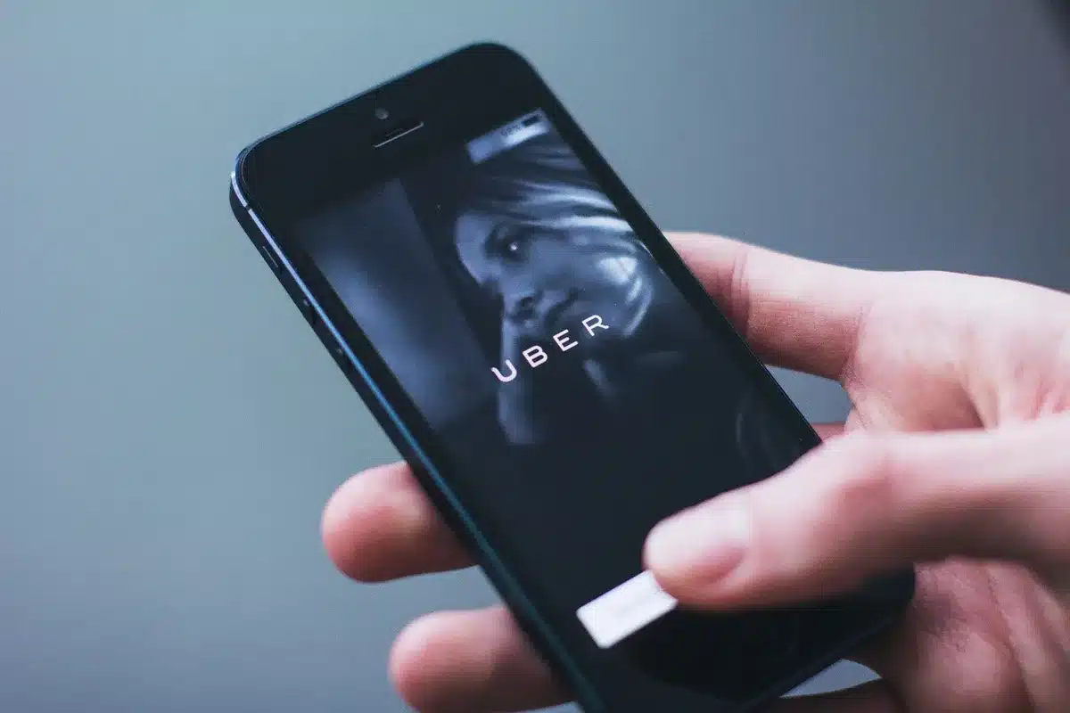 Smartphone showing a ride-hailing app with destination and driver details