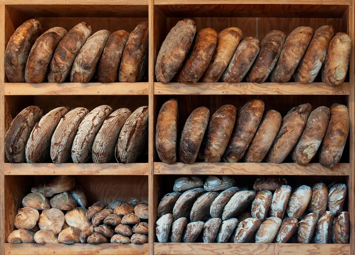 Freshly baked loaves of bread displayed in a traditional bakery