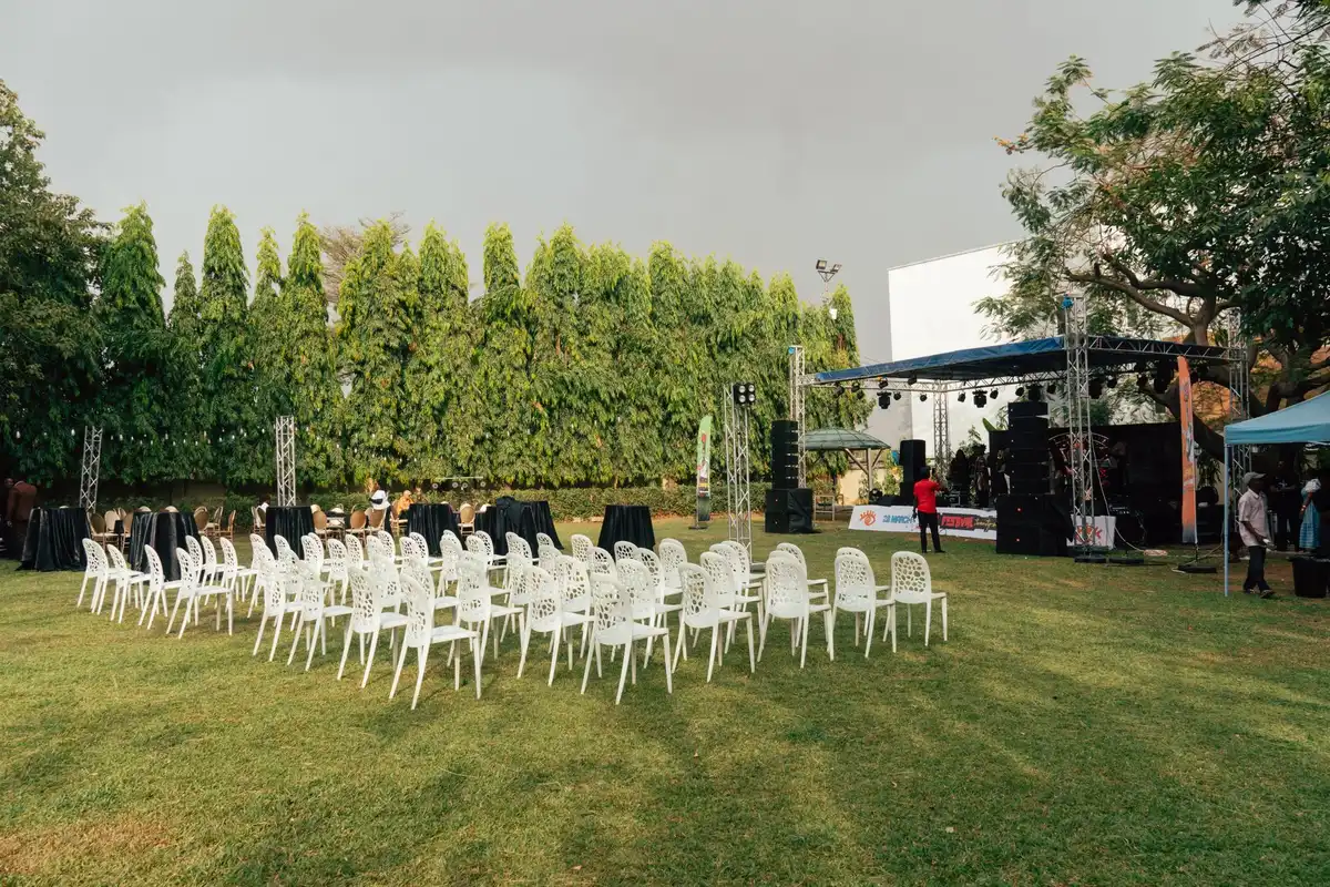 Large outdoor festival stage and setup on estate grounds during summer event preparation