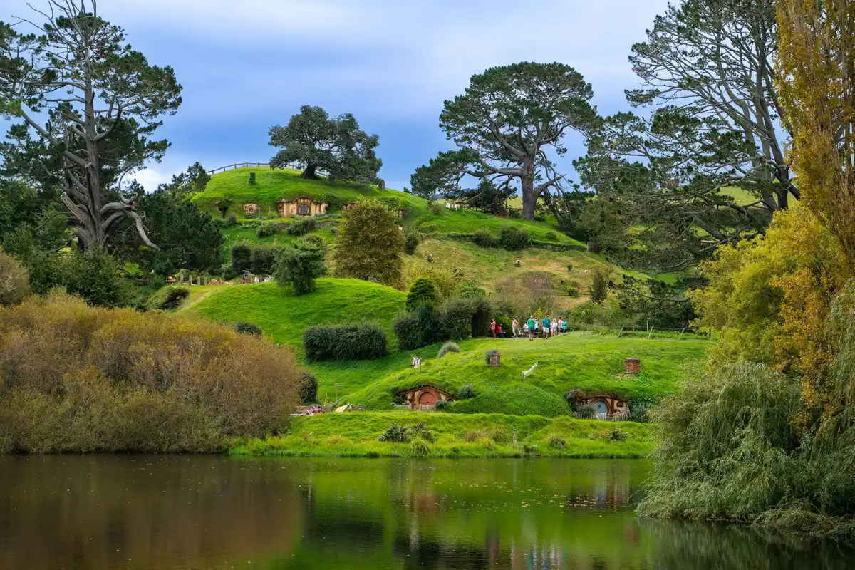 Detailed hobbit hole from the Hobbiton movie set, showing round green door and small-scale architecture