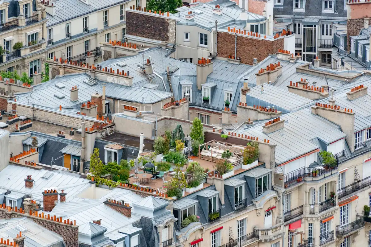 Parisian rooftop terrace with city skyline views, ideal for evening celebrations
