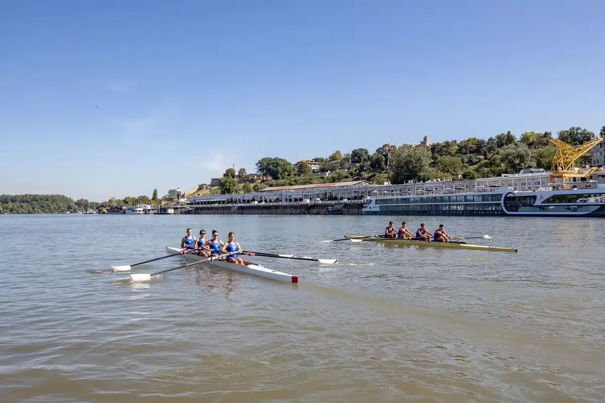 Rowers working together in a boat during training on the water