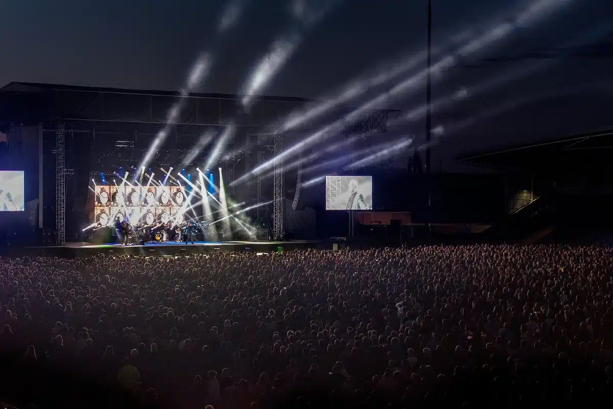 Crowd gathered at a festival main stage in the evening