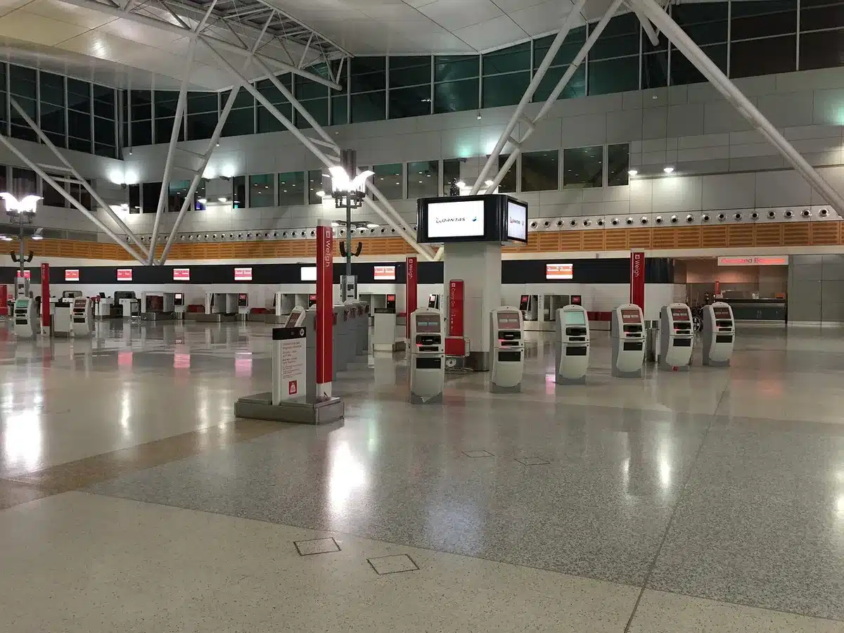Delayed flight luggage and ground crew at an airport