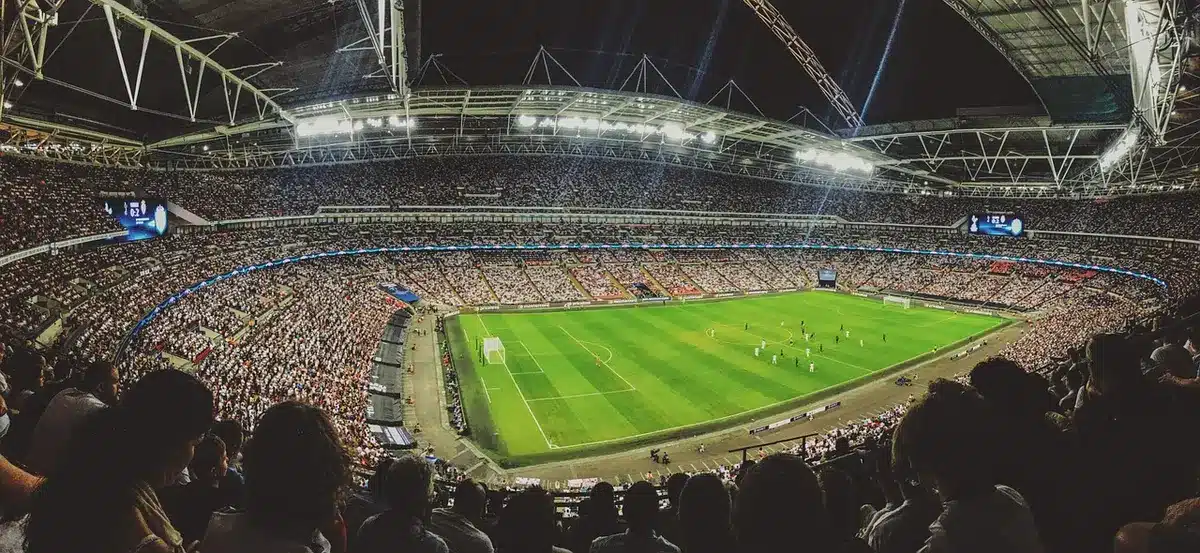 Football supporters watching a GAA match at a stadium