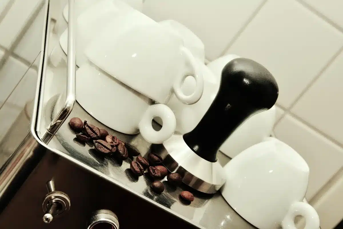 Automatic espresso machine with digital display and one-touch drink buttons on a kitchen counter