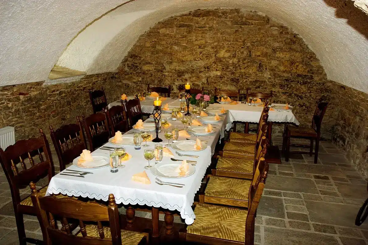 Elegant restaurant interior with tables set for service in daylight