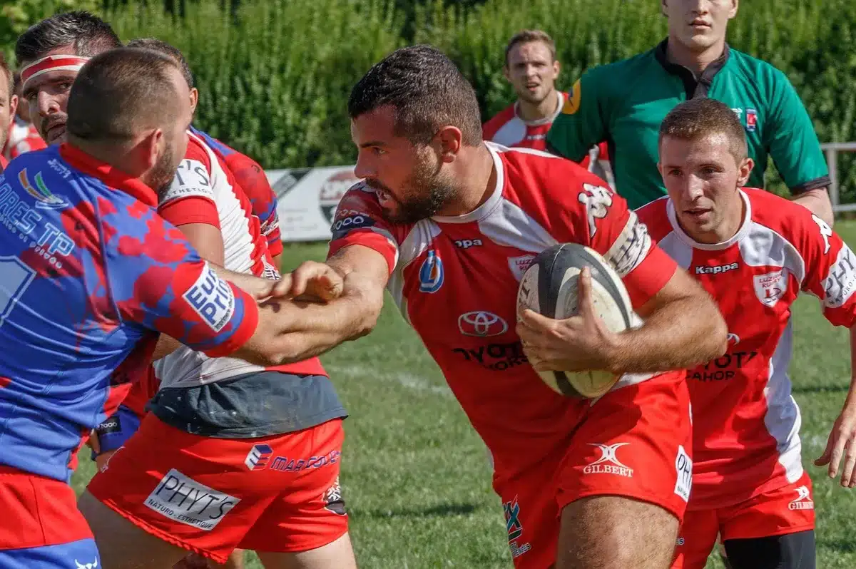 Young rugby captain leading teammates on the sideline