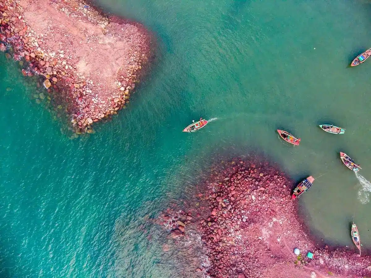 Aerial view of a luxury European resort on a sunny coastline