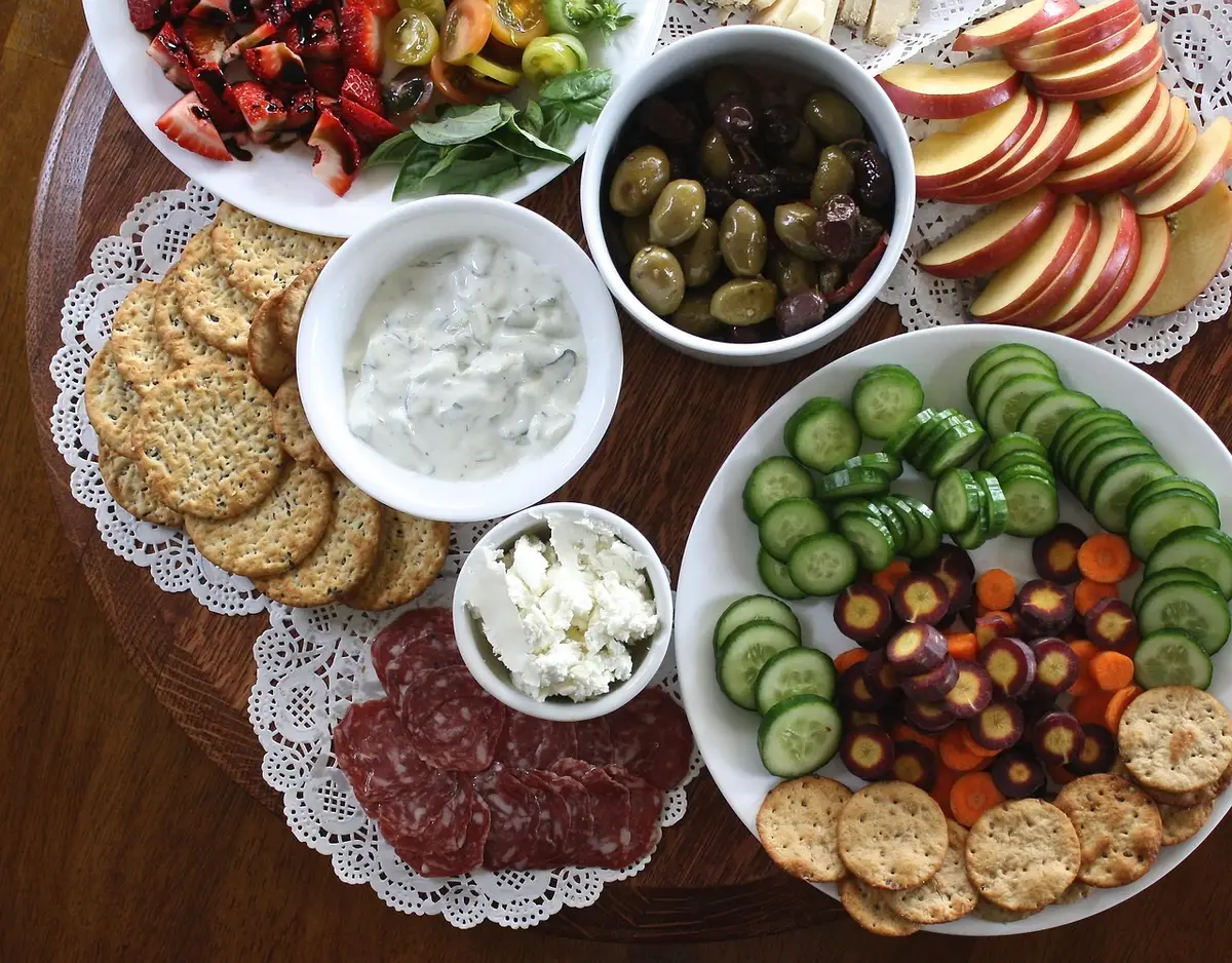 Do-it-yourself charcuterie tree being assembled on a table