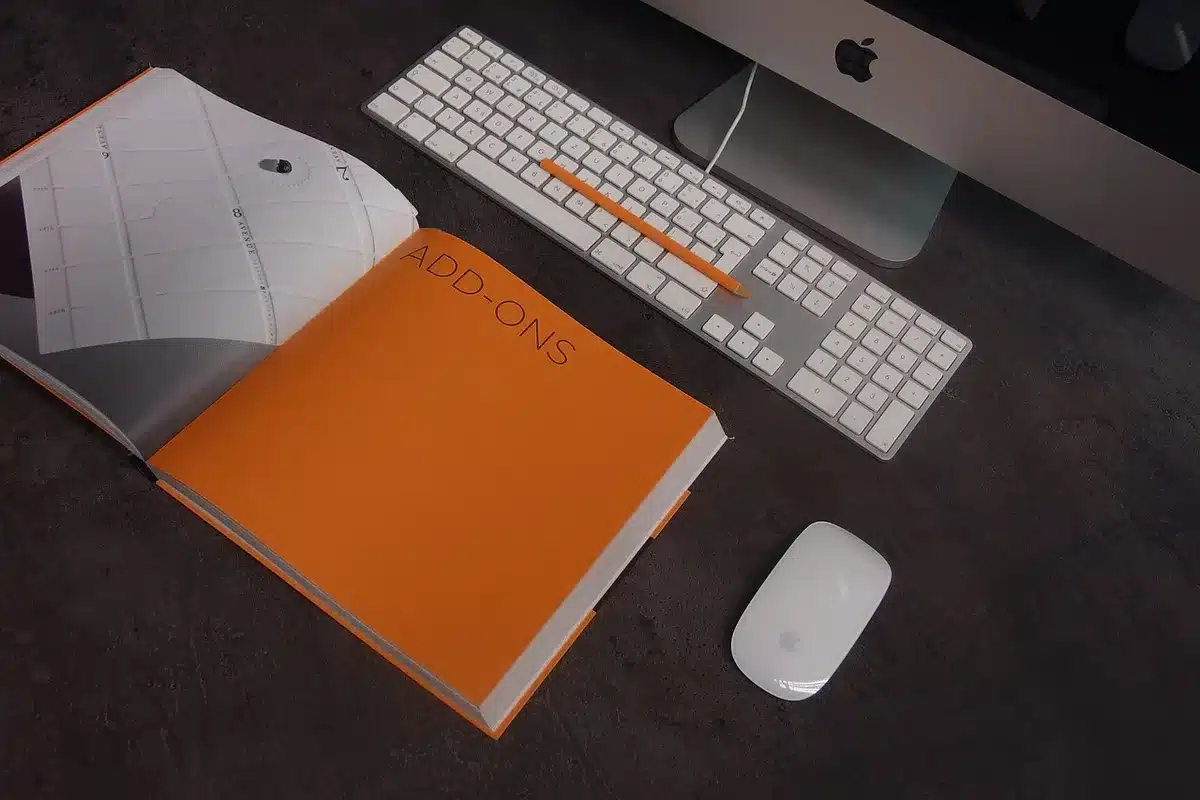 Office desk with books and laptop representing a tech background