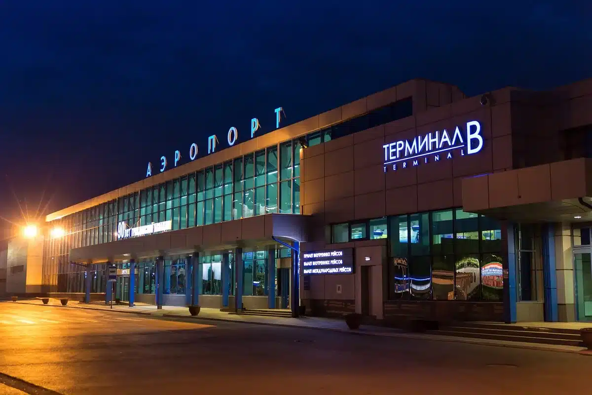 Passengers arriving at an airport terminal during the day