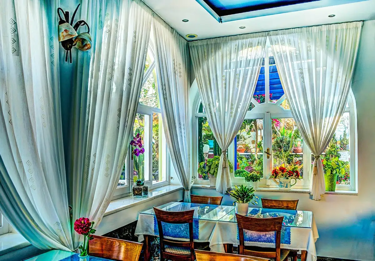Dining room inside a restored 19th‑century mansion with period features